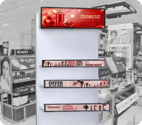 Empty cosmetic retail shelf with promotional signage for premium makeup and special offers.